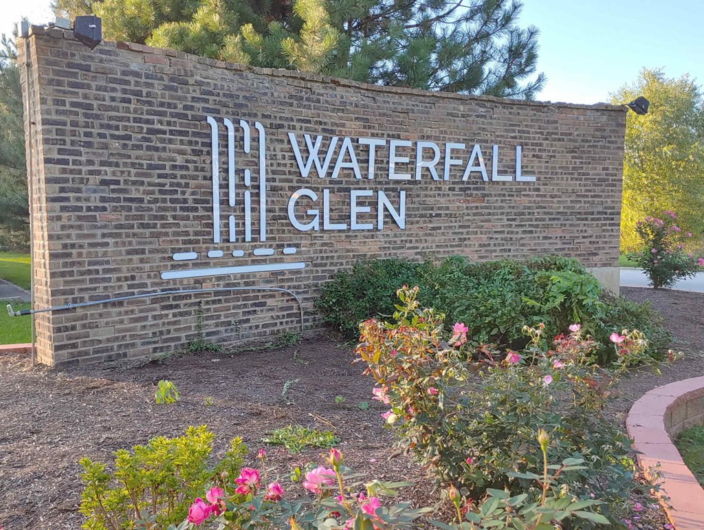 a brick wall with the sign on it