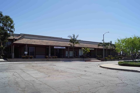a building with a parking lot in front of it