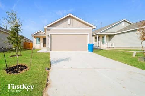 a home with a driveway and a garage door