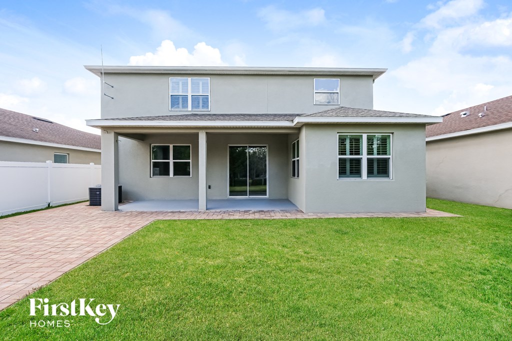 A house with a lawn in front of it.