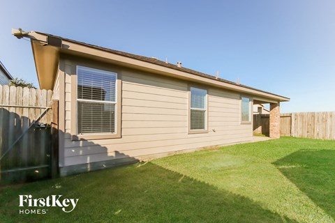 the exterior of a house with stairs and a yard