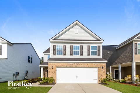 a house with a white garage door in front of it