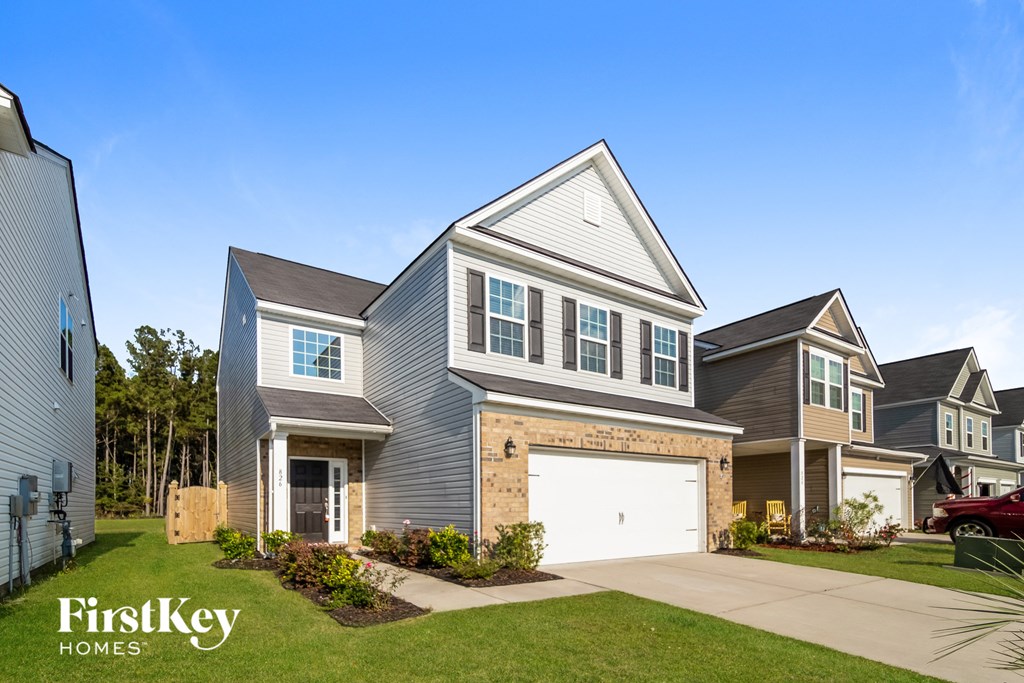 a house with a garage door in front of it