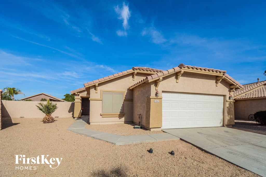A house with a garage door is for sale.