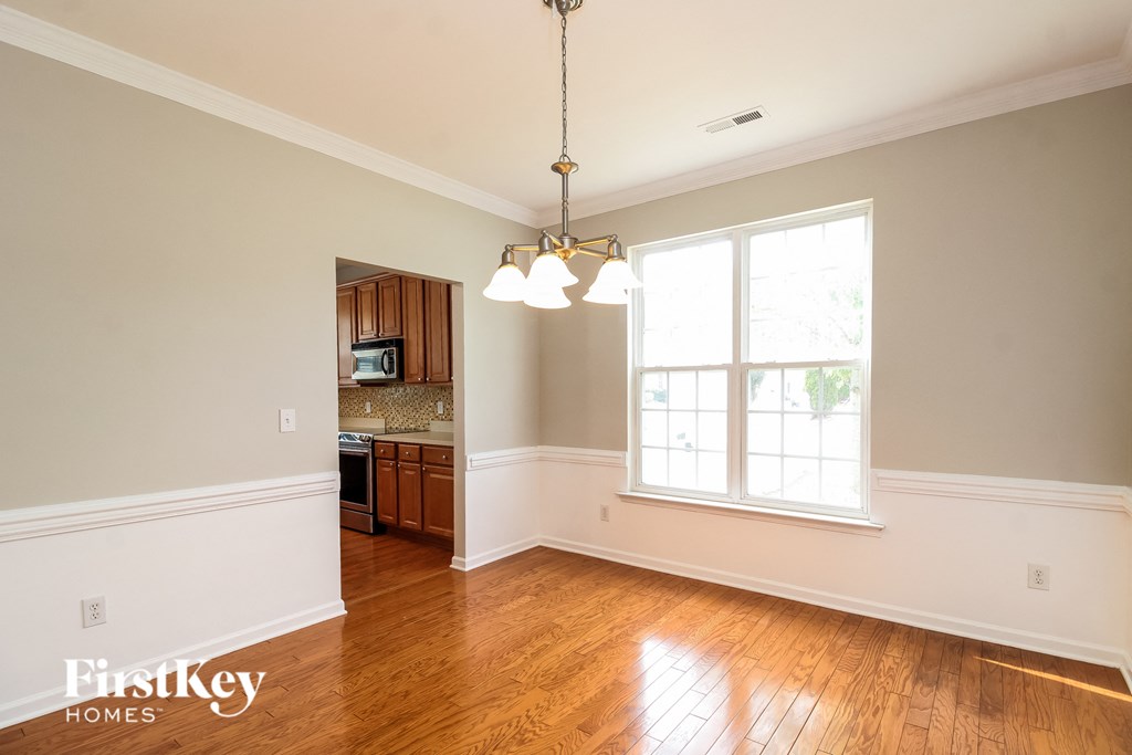 A room with wooden floors and a window.