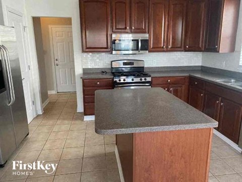 a kitchen with a stove and a counter top