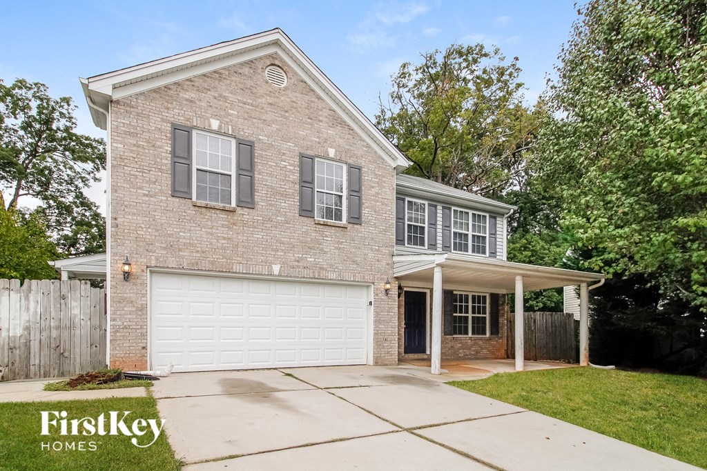 a brick house with a white garage door