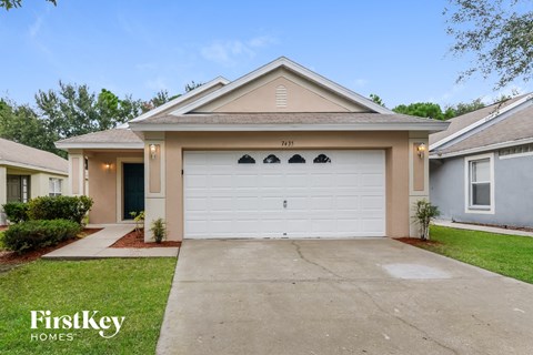 a white garage door in front of a house