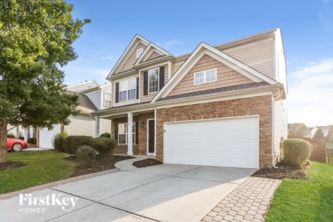 a brick house with a white garage door