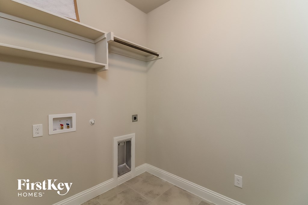 the upstairs bedroom has a wall heater and a window