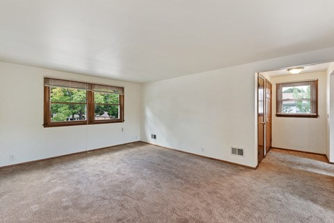 the living room is clean and ready for us to move in