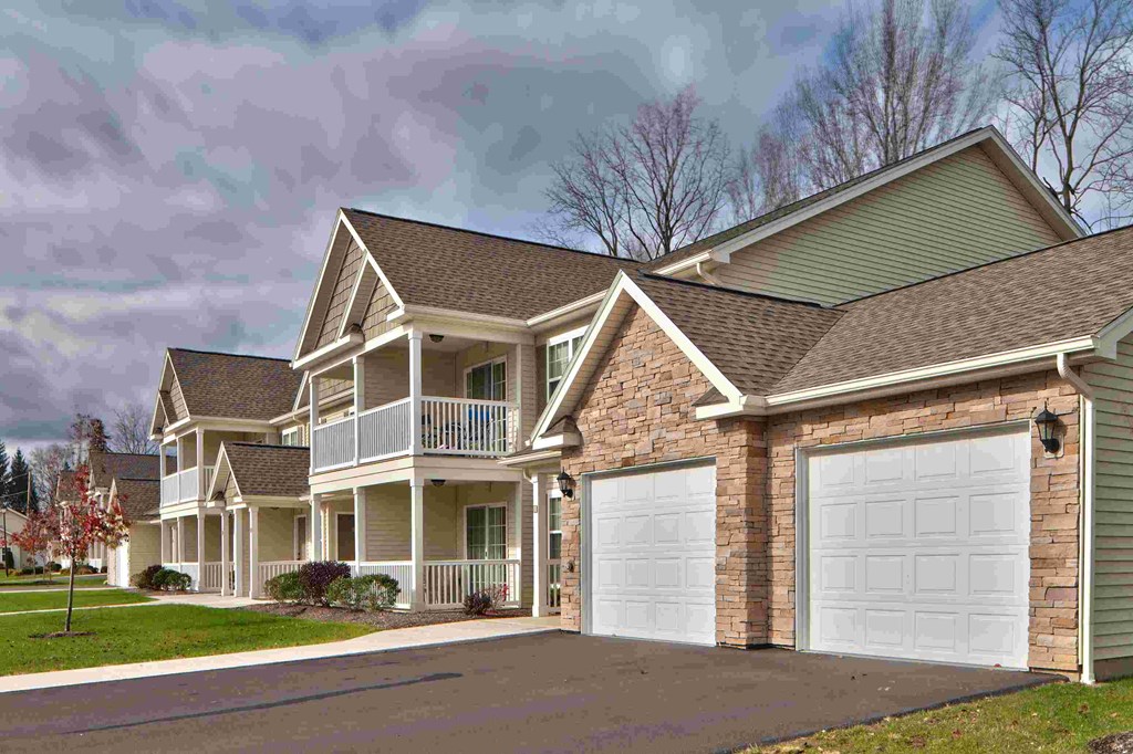 a house with a white garage door in front of it