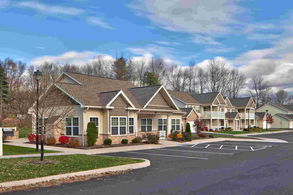a neighborhood of upscale homes on a street with a parking lot