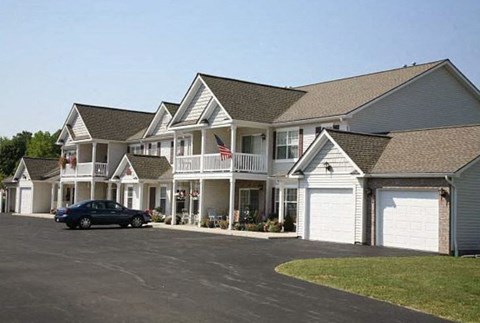a large house with a car parked in front of it