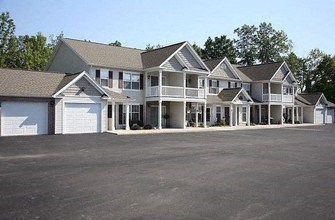 a row of houses with a parking lot