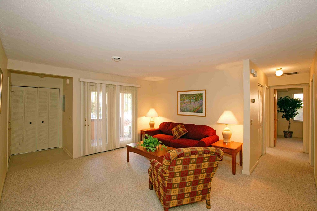 a living room with a couch and a chair