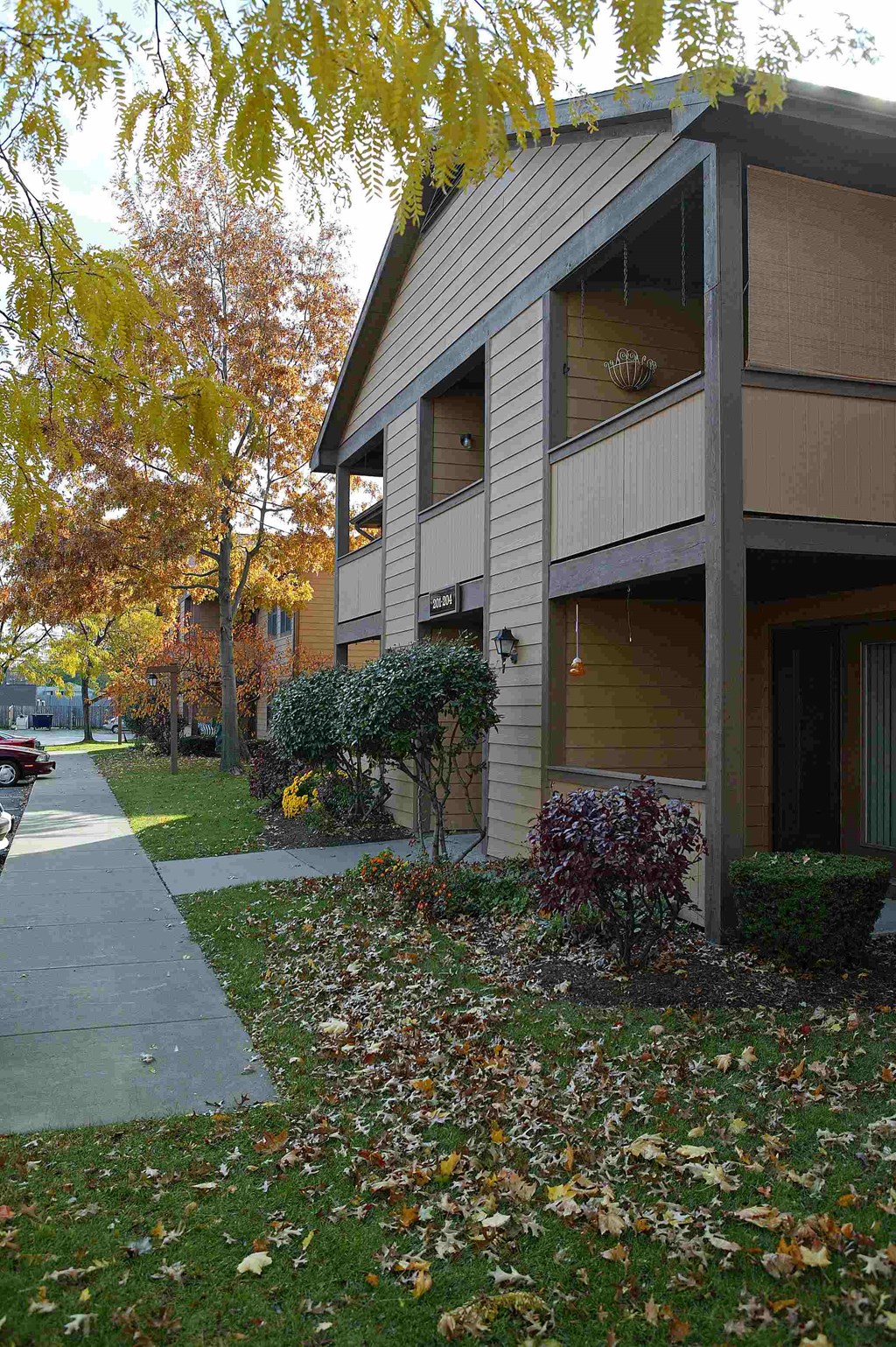 a house with a sidewalk in front of it