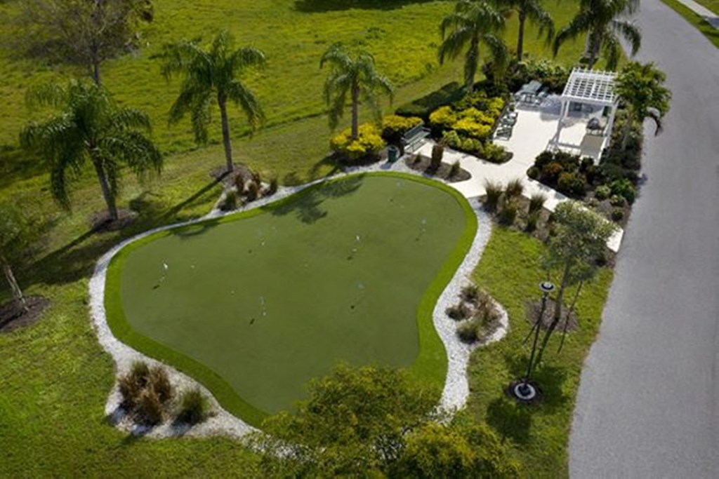 an aerial view of a golf course in a garden