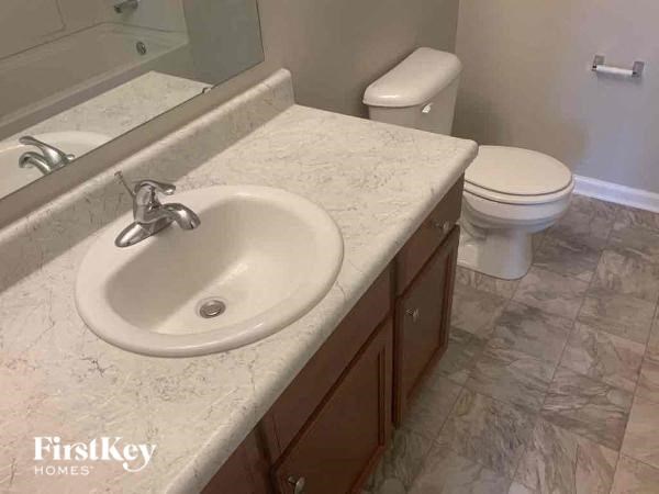 a bathroom with a sink and a toilet