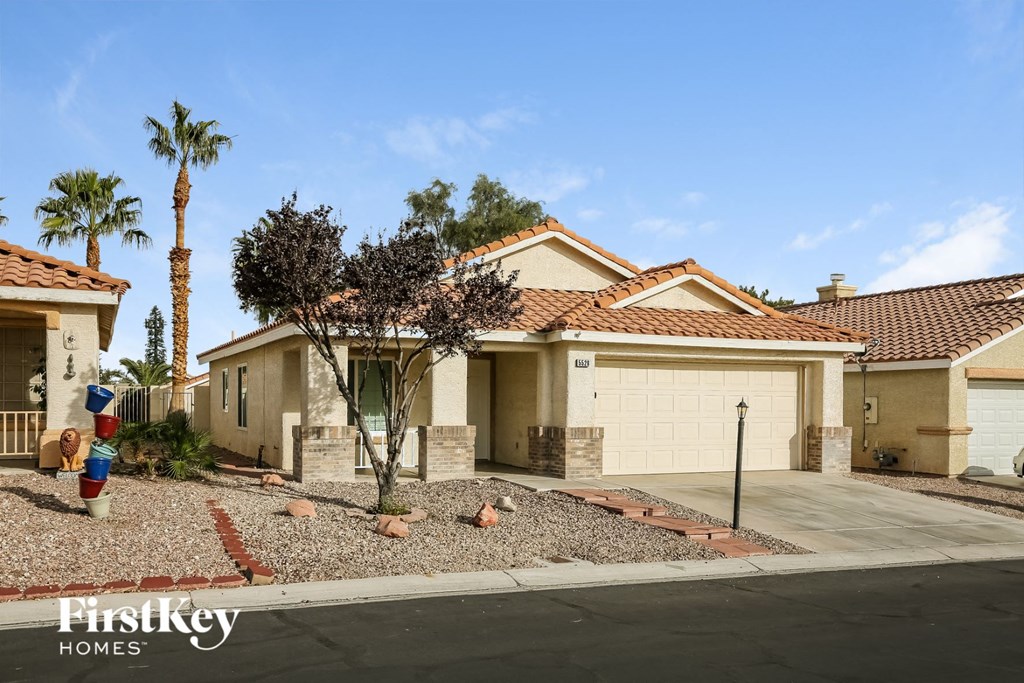 a house with a driveway and a garage door