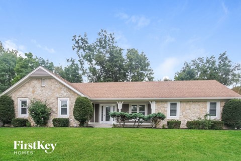 A house with a lawn in front of it.