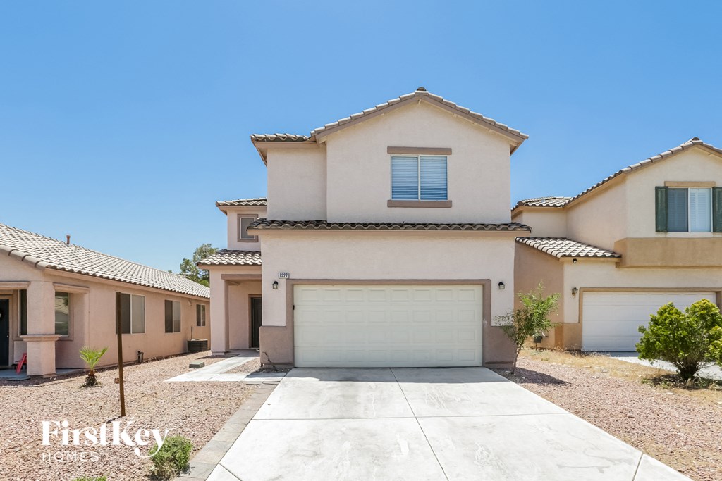 a house with a garage door in front of it