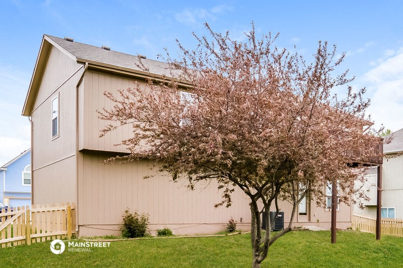 a house with a tree in front of it
