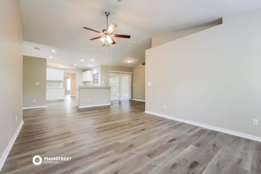 the spacious living room and kitchen of this manufactured home