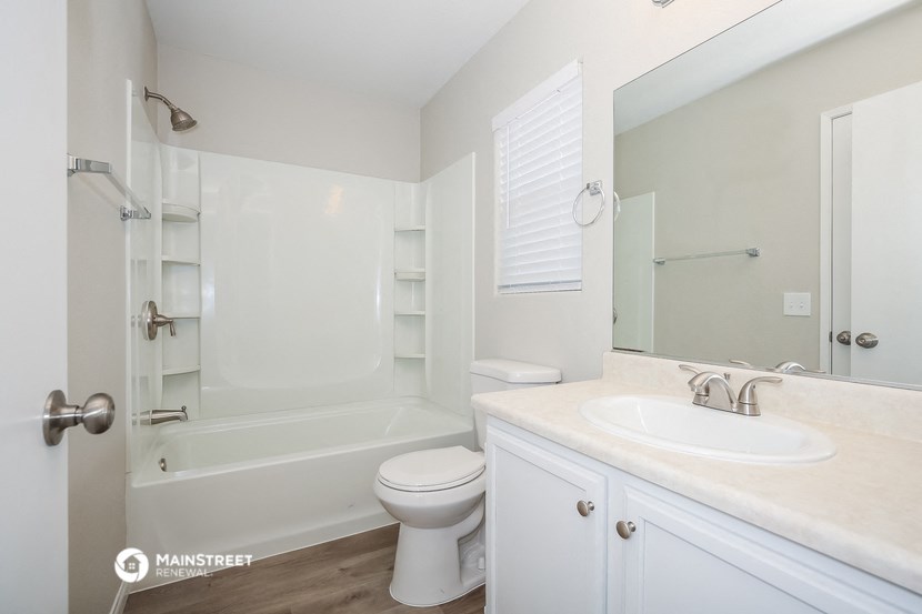 a bathroom with a sink toilet and a shower