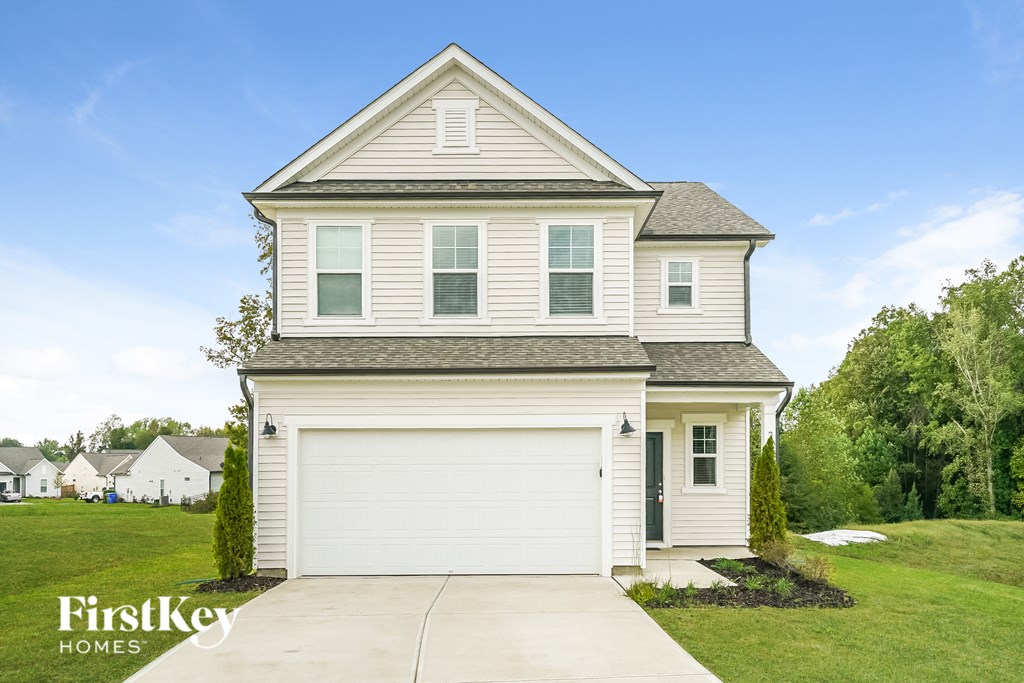 a white house with a white garage door
