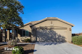 a home with a garage door in front of it