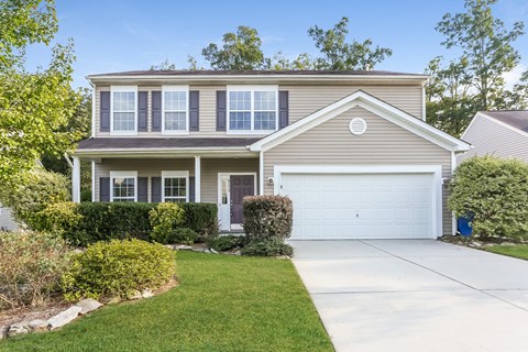 a house with a white garage door in front of it