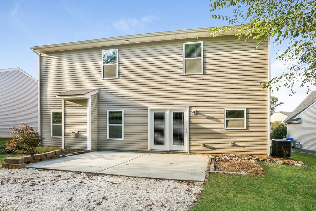 the front of a house with a ramp to a driveway