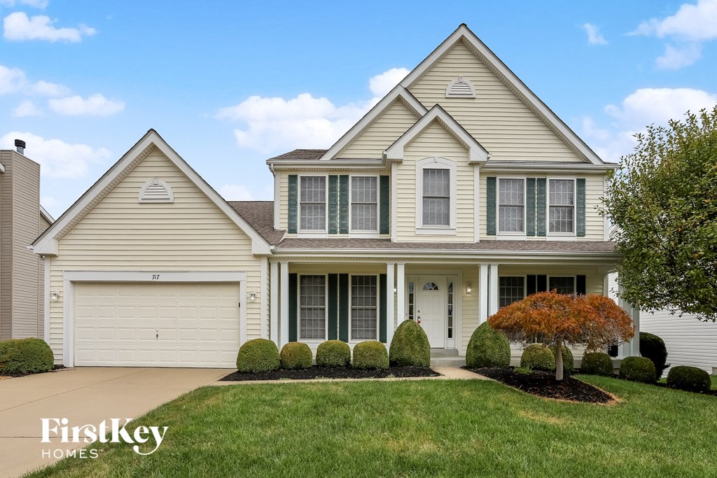 a white house with a lawn in front of it