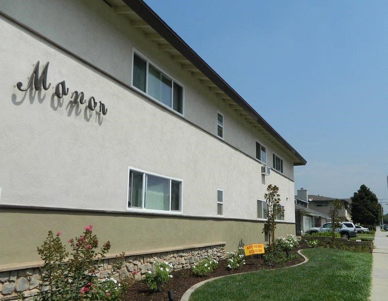 a white building with a sign on the side of it