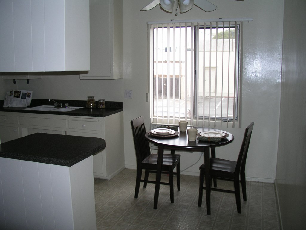 an image of a kitchen with a table and chairs