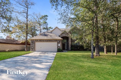 a house with a driveway and a garage door