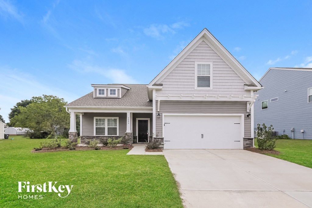 A house with a garage is for sale by FirstKey Homes.
