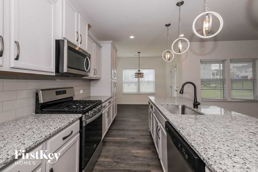 A kitchen with a FirstKey Homes logo.