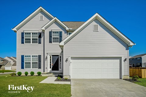 A two-story house with a garage is for sale by FirstKey Homes.