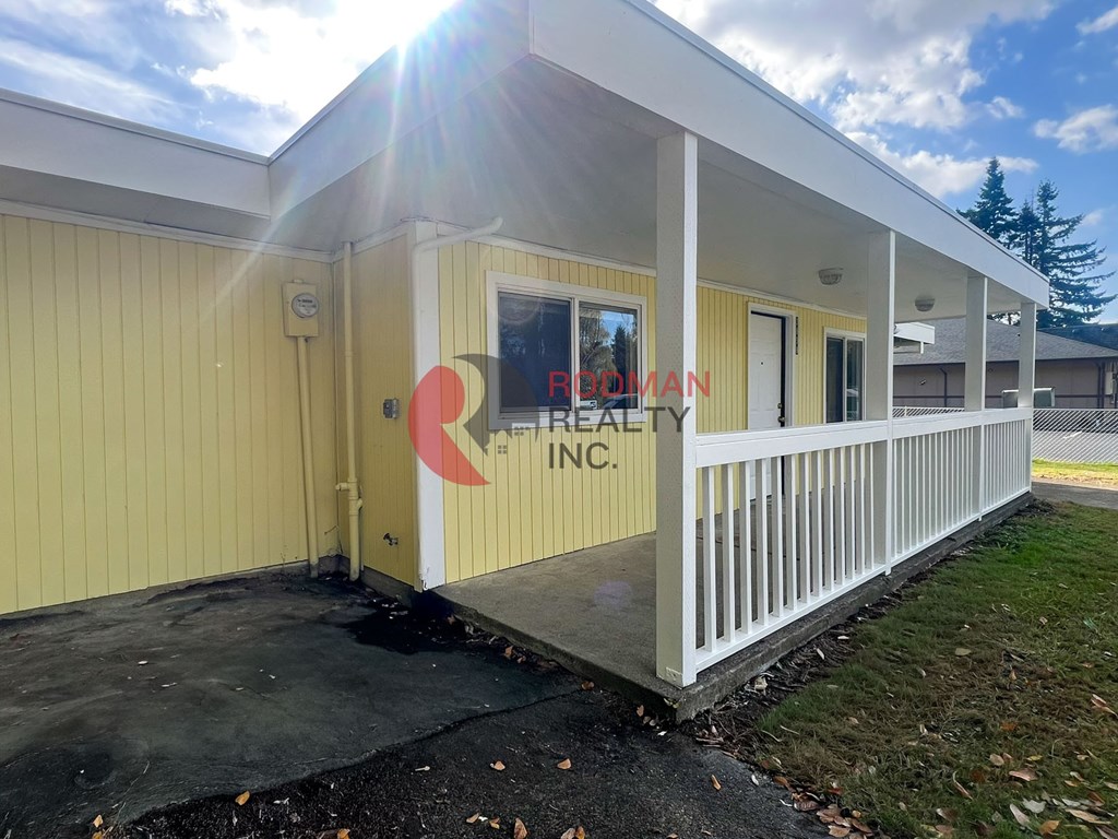 A building with a red and white logo on the side.