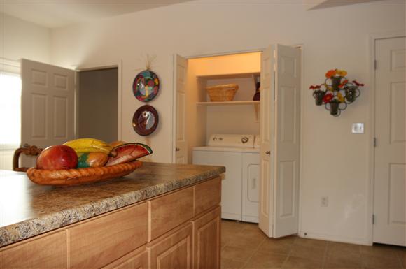 Kitchen area and washer and dryer-Matthew Henson IV Apartments, Phoenix, AZ