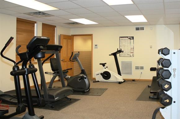 a gym with some exercise equipment in it