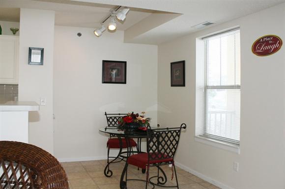 a dining room with a table and chairs