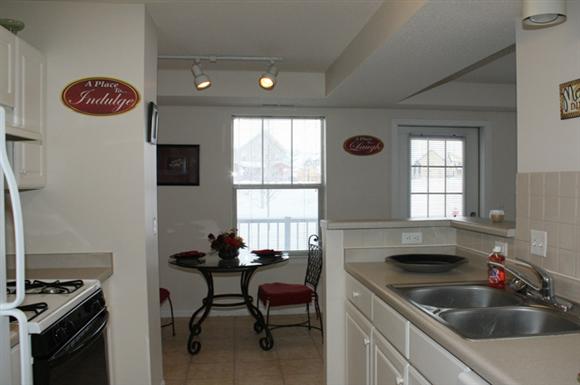 a kitchen with a sink and a table