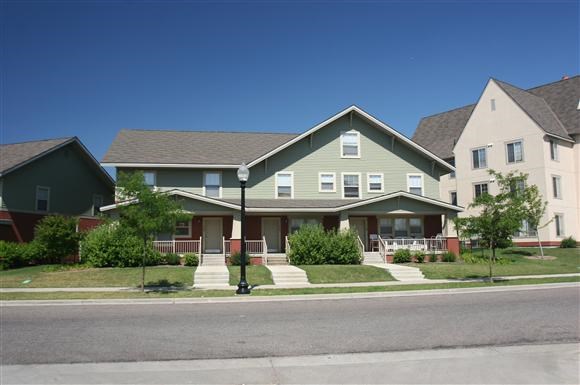 a row of houses on the side of a street