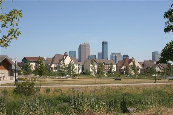 a neighborhood with a city in the background