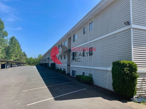 A Rodman Health Inc. building with a parking lot in front.