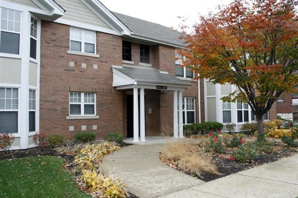 a brick building with a walkway in front of it