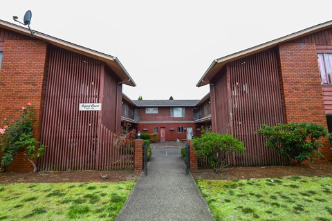 A red brick building with a sign that says "Gatehouse".